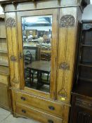 An oak Art Nouveau wardrobe with two drawers under