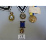 A masonic medal and three others