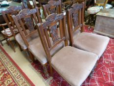 A set of five carved back chairs with upholstered
