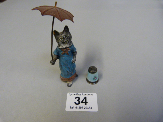 A Cold Painted lead cat and a hallmarked silver th