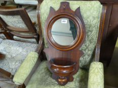 Small round mirror with well under