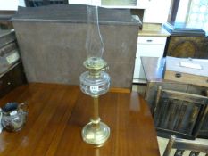 Oil lamp with brass base and clear glass well