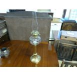 Oil lamp with brass base and clear glass well