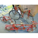 Four scale models of various bicycles