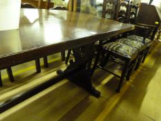 A dark oak dining suite consisting of refrectory t