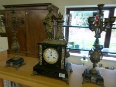 A Slate clock garniture enhanced with figures