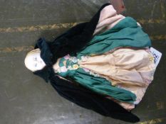A bisque china headed doll in original clothing