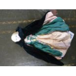 A bisque china headed doll in original clothing