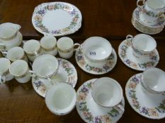 A Part Wedgwood tea service and a part Country Lan