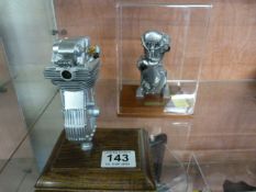 Two models of a Velocette engine and a Norton engi