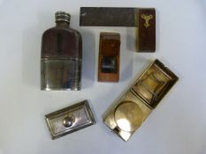 A hip flask, travel paraffin heater, and a plane e