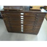 A Stained pine plan chest