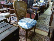 A Wicker back oak framed chair