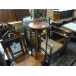 A brass standard lamp and an inlaid plant stand