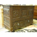 A Heavily carved darkwood sideboard