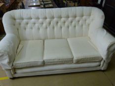 A White upholstered two seater settee