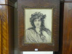 Art Nouveau print of a lady in an oak frame