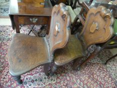 Two oak hall chairs
