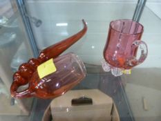 A cranberry glass pipe and jug