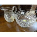A heavy cut glass jug and a cut glass bowl
