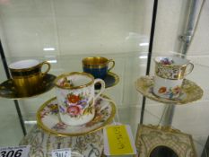 Four cabinet cups including Worcester