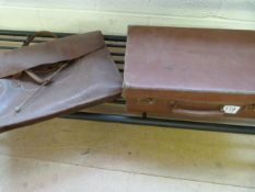 A leather satchel and small suitcase