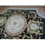 A gold patterned ground rug