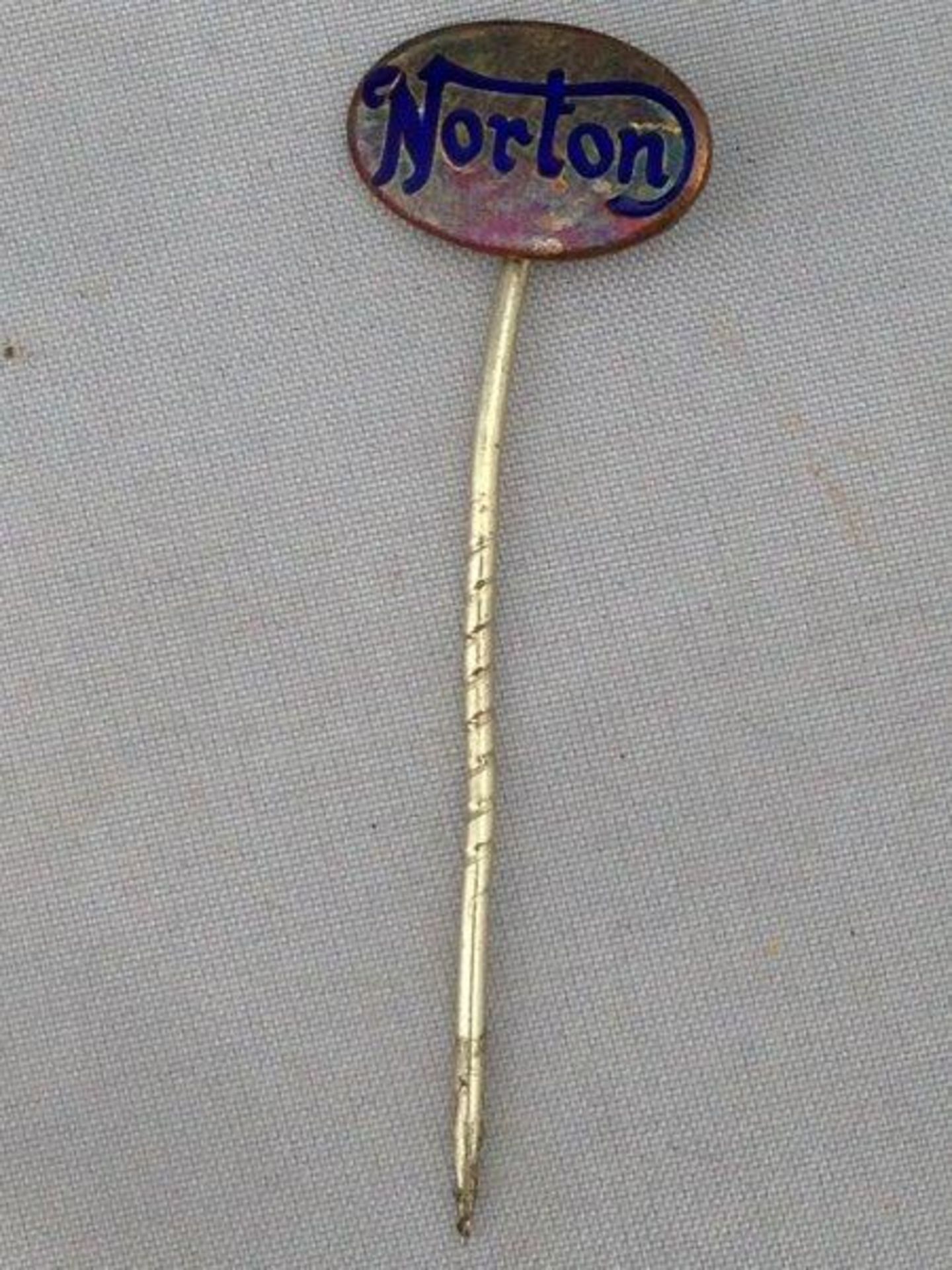A Norton stick pin.
