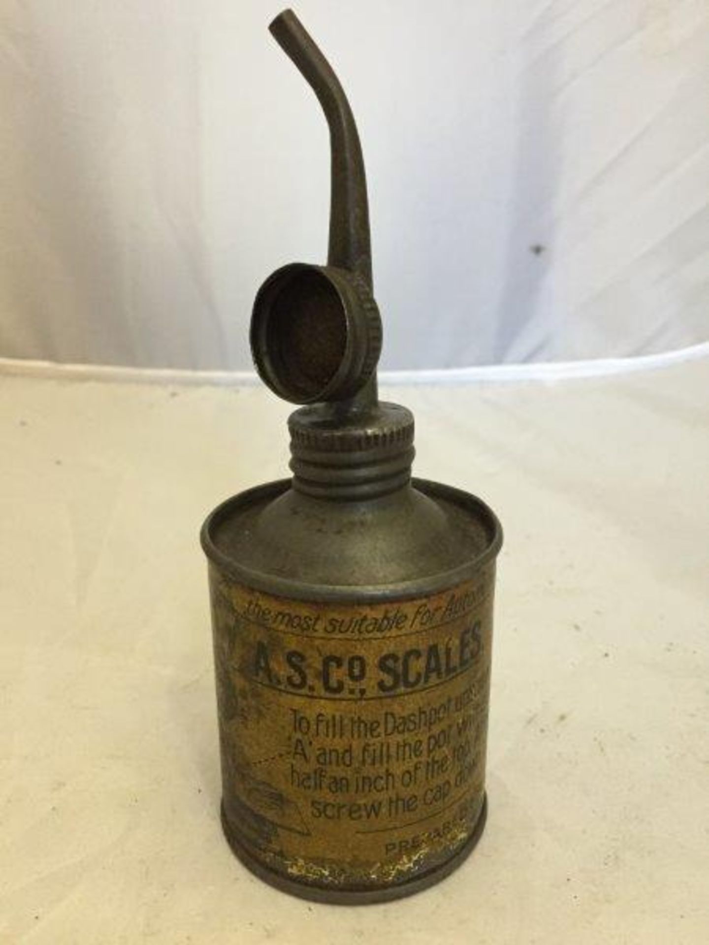An A.S. Co. Scales dashpot oil can with two-way spout.