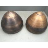 A pair of newly spun headlamp shells.