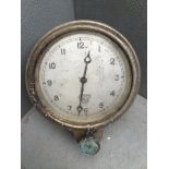 A Smiths white faced eight day car clock with bottom wind.