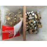 A quantity of brand new battery terminals and brass electrical clips.