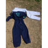 A selection of mostly white workshop overalls, also a blue pair of overalls with BP insignia, also