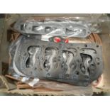 A box of new old stock gaskets including head gaskets, a manifold etc.