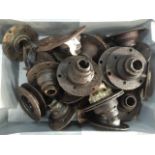 A box of Austin 7 hubs, two with bearings inside.