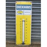 A Duckhams 20-50 Motor Oil enamel thermometer, 13 x 36".