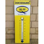 A Duckhams 20/50 Motor Oil enamel thermometer by repute in working original condition, 13 x 36".