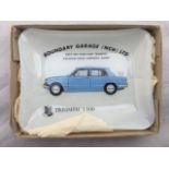 An early glass trinket dish with design depicting the Triumph 1300 advertising Boundary Garage (NCH)