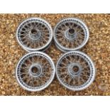 Four matching 15" Dunlop wire wheels.