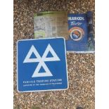 A Bluecol tester chart, an MOT testing station sign and one other.