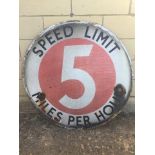 An early circular enamel sign - Speed Limit Five Miles per Hour, set withn an original wrought