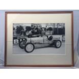 Philippe Etancelin - a framed and glazed print depicting the driver beside a Maserati at the 1934