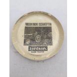 A Fordson Major Tractor glass paperweight.