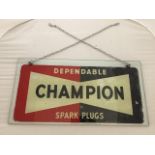 A Champion Dependable Spartk Plugs glass hanging showroom sign, 20 x 10".