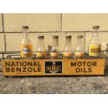 An NBC National Benzole Motor Oils seven bottle crate with front advertising panel and five NBC