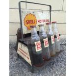 A Shell Motor Oil double sided eight bottle crate containing eight various oil bottles.