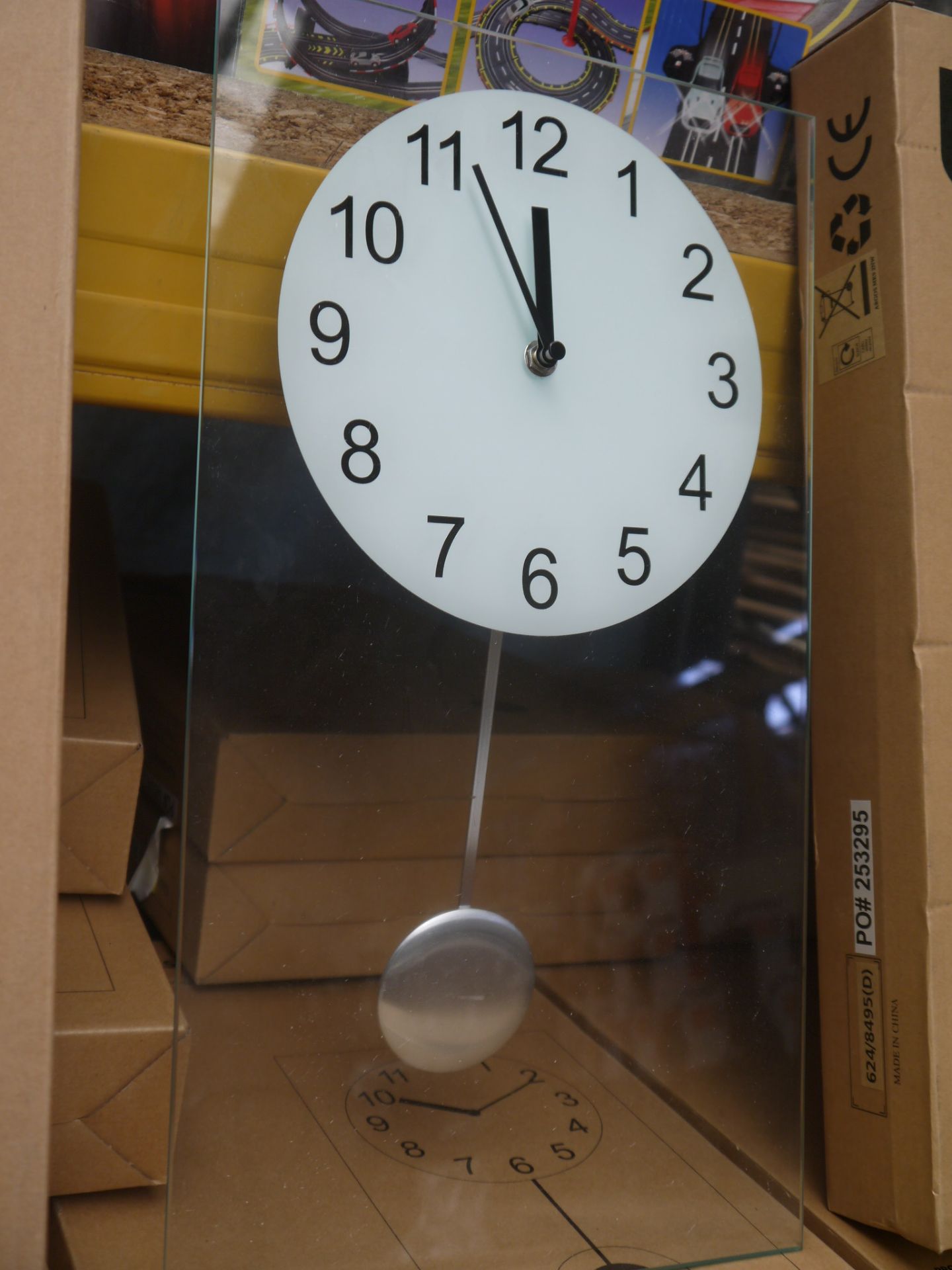 Living clear glass pendulum clock 45x25cm, boxed