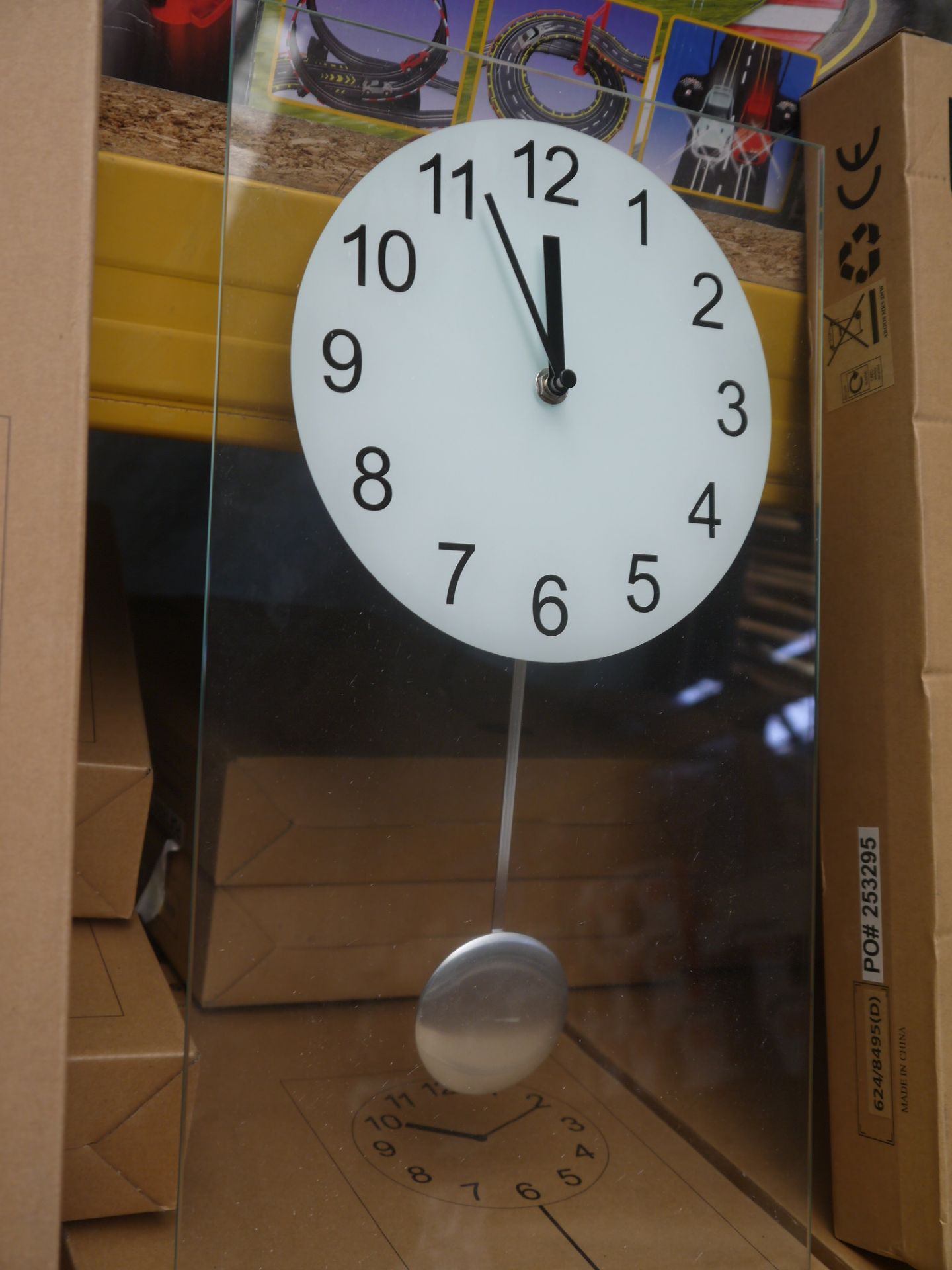 Living clear glass pendulum clock 45x25cm, boxed