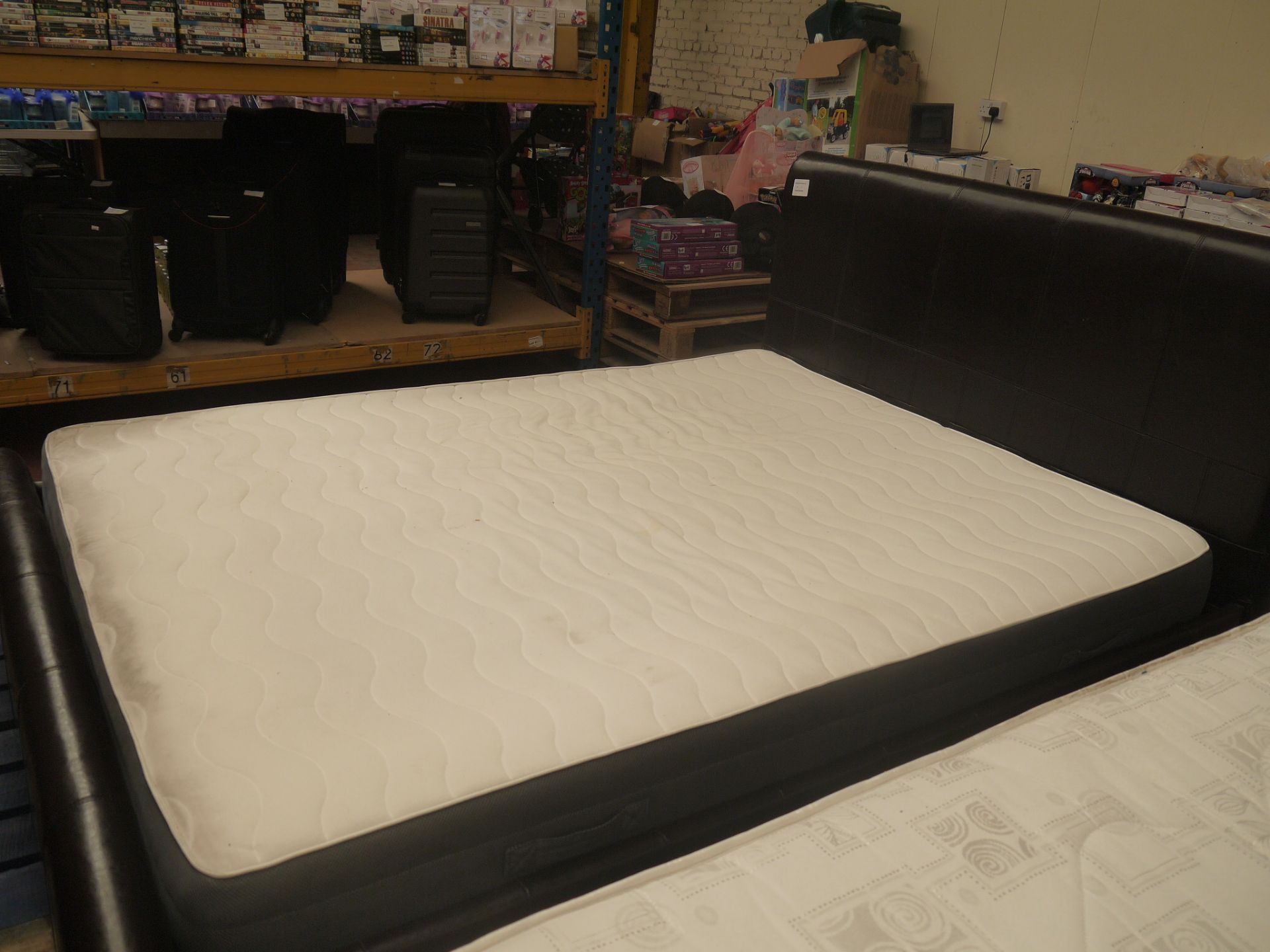 king sized brown leather bed plus a king sized memory foam mattress that needs bit of cleaning