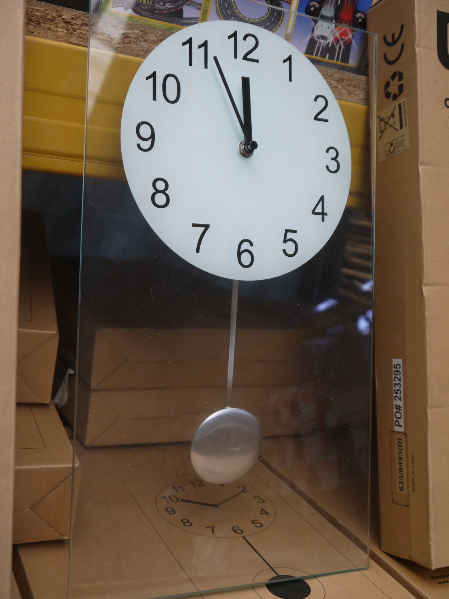 Living clear glass pendulum clock 45x25cm, boxed